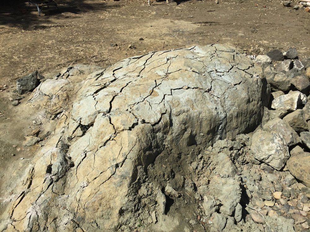 A boulder split cleanly apart using Dexpan demolition grout